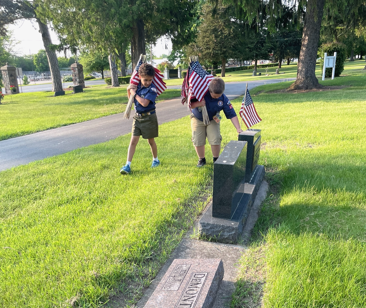 Marlborough scouts place flags on veterans' graves