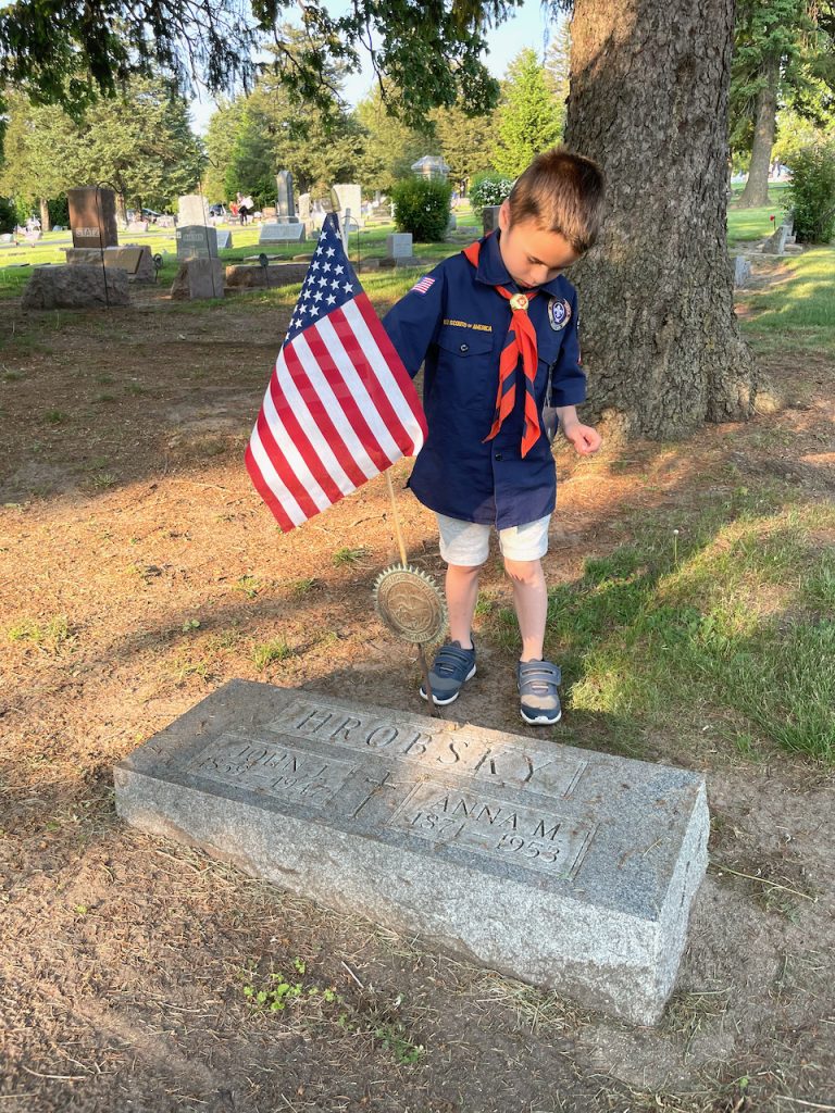 Marlborough scouts place flags on veterans' graves