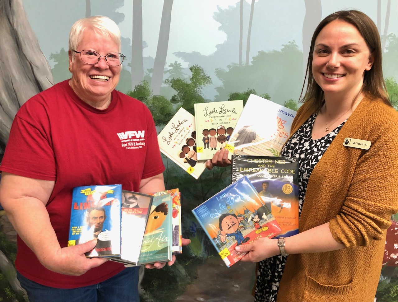 Post 1879 Auxiliary donates nine books to library