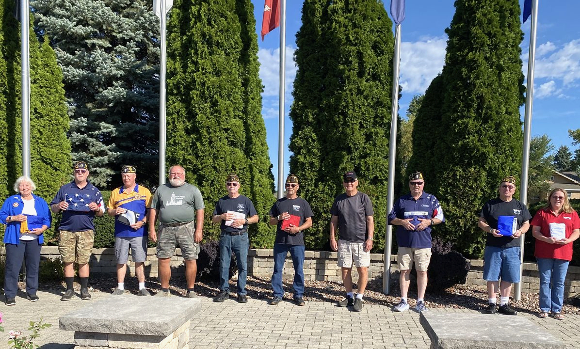 Flags installed at bell tower in Evergreen 